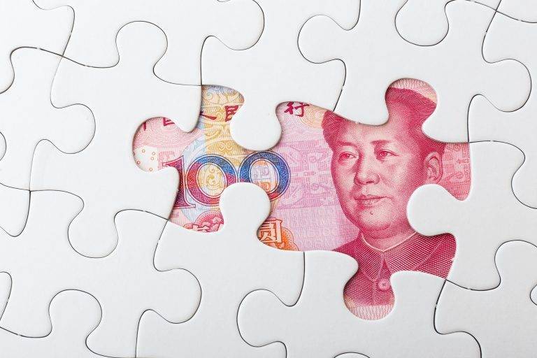 Incomplete puzzle over chinese yuan banknote background