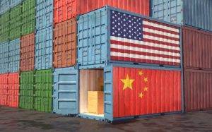 Stacks of Freight containers. USA and China flag