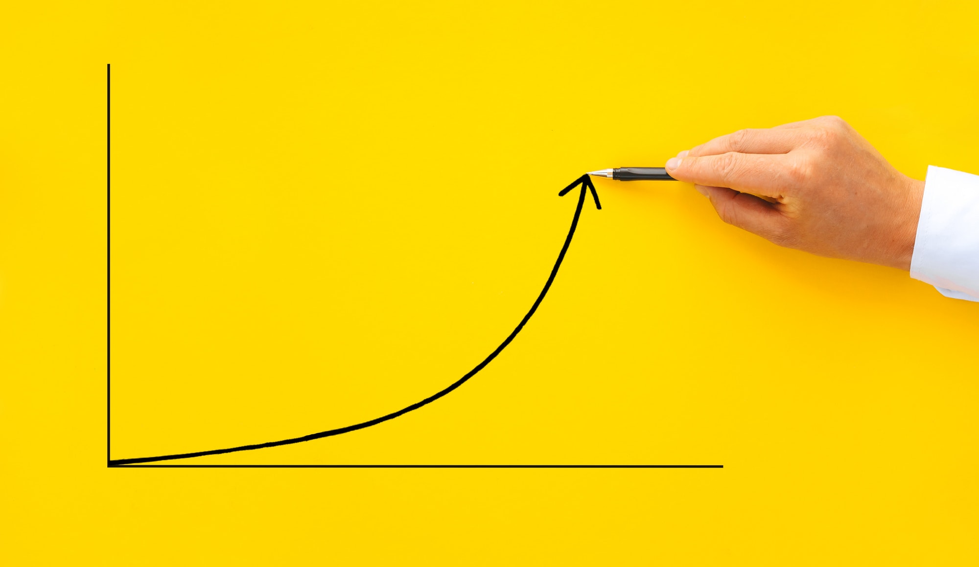Businessman pointing arrow graph with pen. Business development to success, profit and growing growt