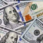 Flat lay background of 100 hundred dollar bills currency, cash, money, economy, spending full frame
