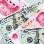 Trade war between two countries USA and China. Chinese rmb yuan and American dollars cash money