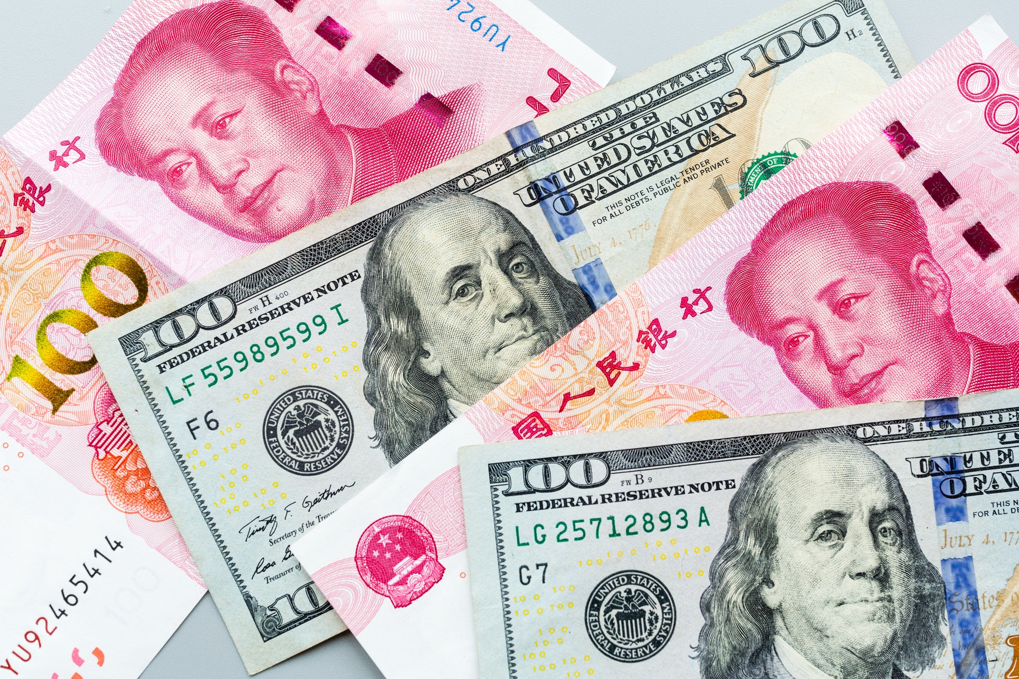 Trade war between two countries USA and China. Chinese rmb yuan and American dollars cash money